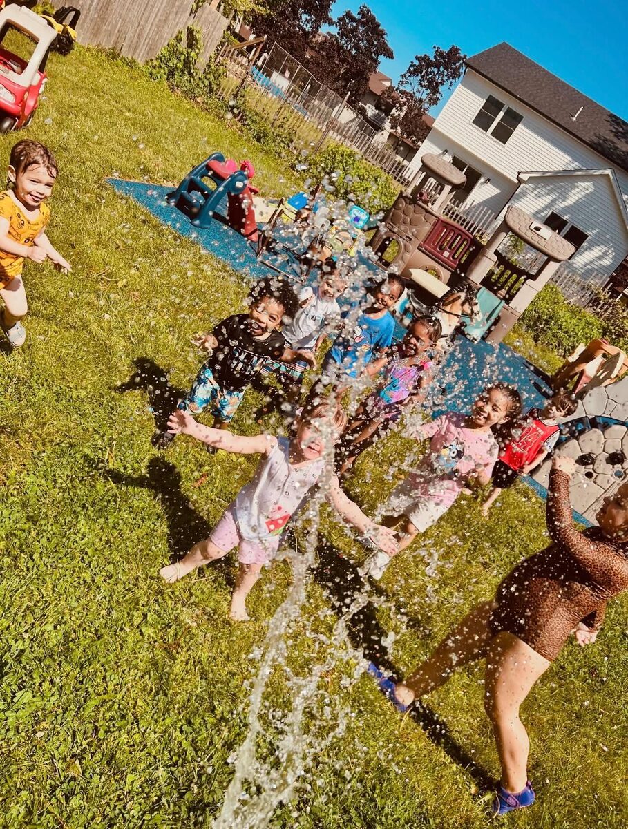 Kids cheering as bubbles fly through the air